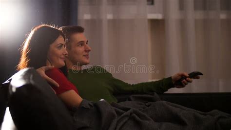 Cute Couple Cuddling Sofa Watching Tv Stock Photos Free And Royalty