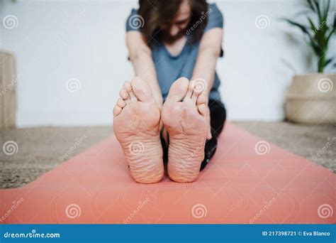 close up of mature caucasian senior woman practicing yoga pose at home healthy lifestyle stock