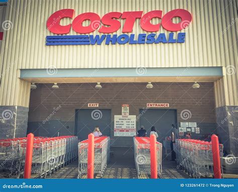 Logo Of Costco And Row Of Shopping Carts At Facade Entrance Editorial