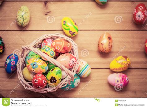 Colorful Hand Painted Easter Eggs In Basket And On Wood Handmade