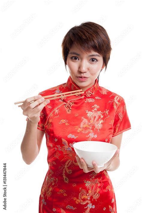 Asian Girl In Chinese Cheongsam Dress With Chopsticks Stock Photo