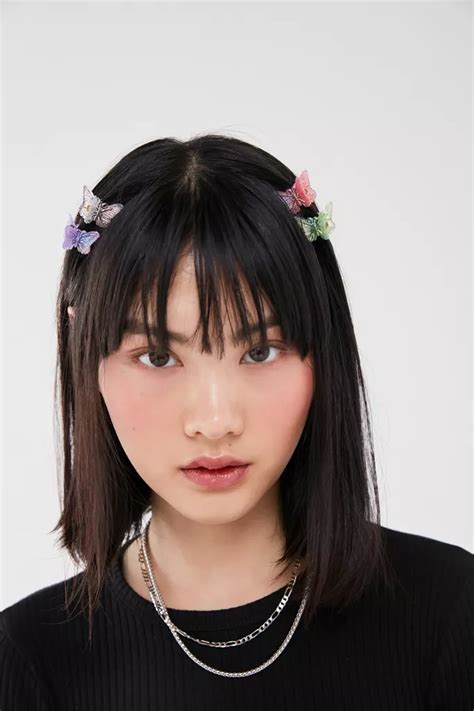 Tousled long layered hair with side swept bangs. Vintage Butterfly Hair Clip Set | Urban Outfitters in 2020 ...