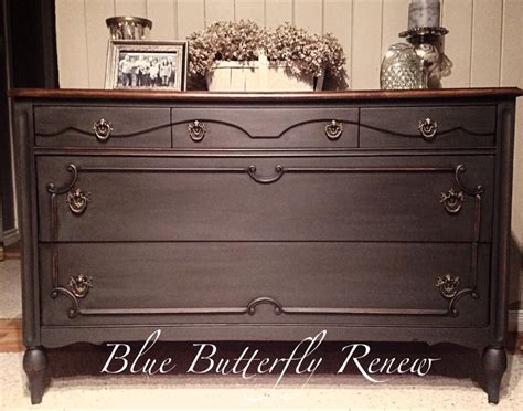 An Old Dresser Has Been Painted Black