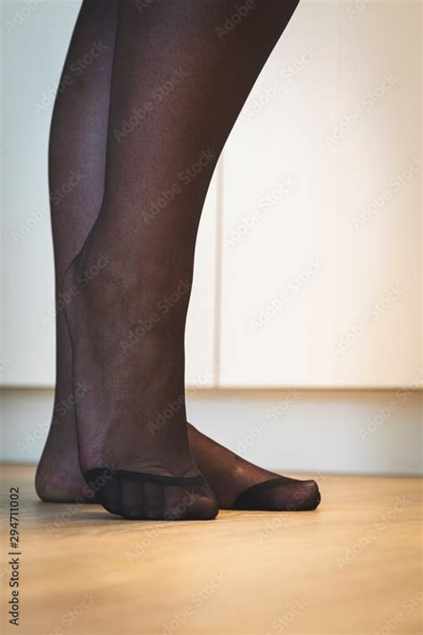 An Elegant Close Up Portrait Of The Feet Of A Girl In Black Pantyhose With The Nylon At The Toes