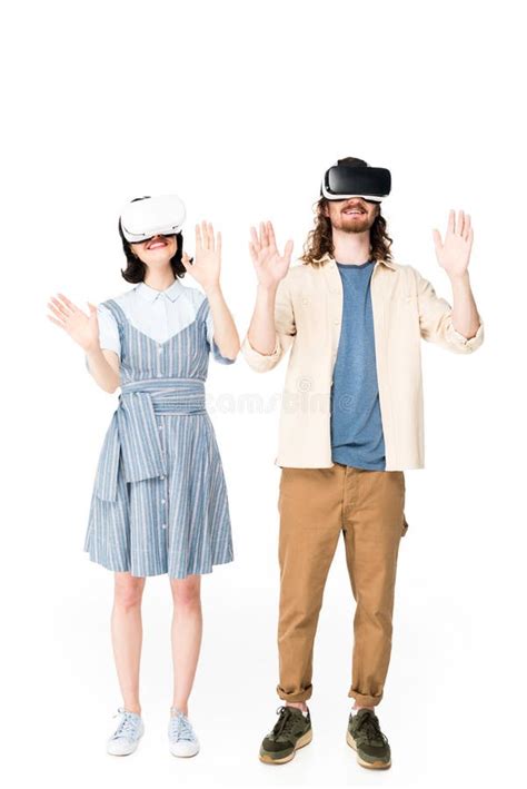 Full Length View Of Two People With VR Headset Raising Hands In Air
