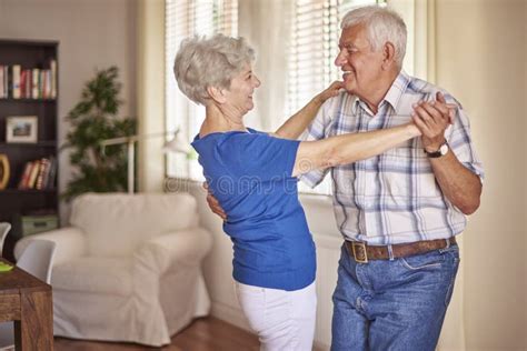 Senior Couple Dancing In Living Room Stock Photo Image Of Facial