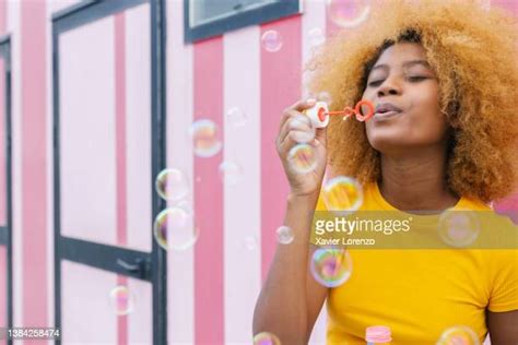 Woman Blowing Soap Bubbles Photos And Premium High Res Pictures Getty Images