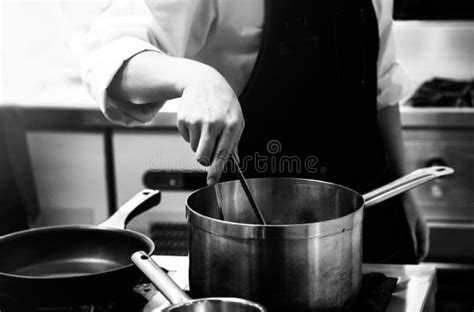 Chef Cooking In A Kitchen Chef At Work Black And White Stock Photo