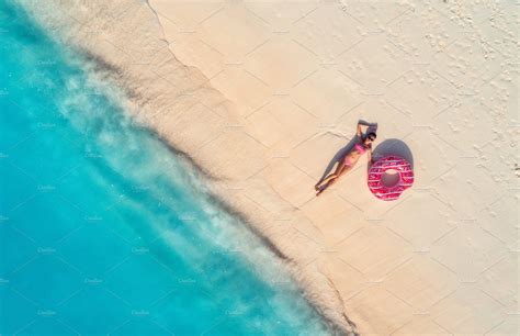 Aerial View Of Woman On The Beach By Den Belitsky On Creativemarket