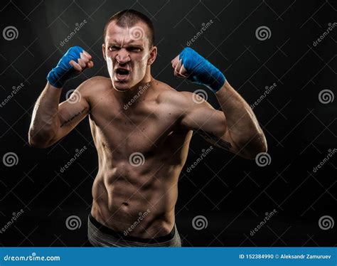 Muscular Man Standing With Mouth Opened Holding Fists Up Studio Shot Stock Photo Image Of
