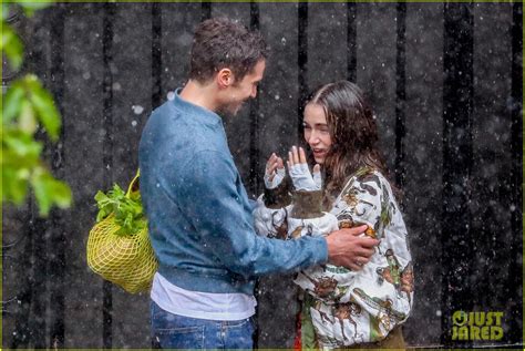 Lily Collins Gets Caught In The Rain With Lucas Bravo For Emily In