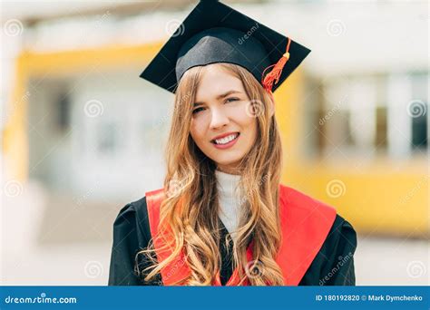 Happy Graduate Student With A Diploma Smiles Concept Of The Graduation