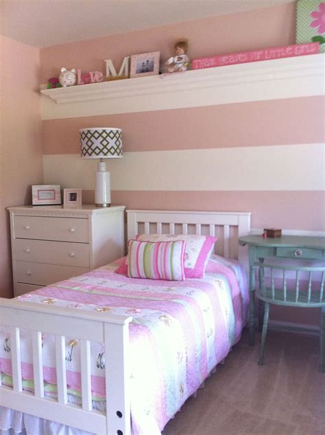 Ecru walls and white bedding let the upholstered headboard stand out with its stylized botanical pattern in blush pink and gray. Girls Room, Pink and white wide stripe, mcubed interiors ...
