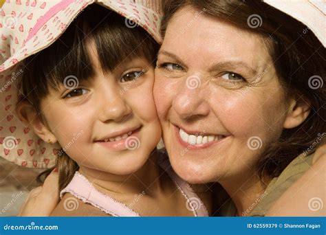 Granddaughter Hugging Upset Old Grandma With Walker Looking At Camera Outdoors Royalty Free