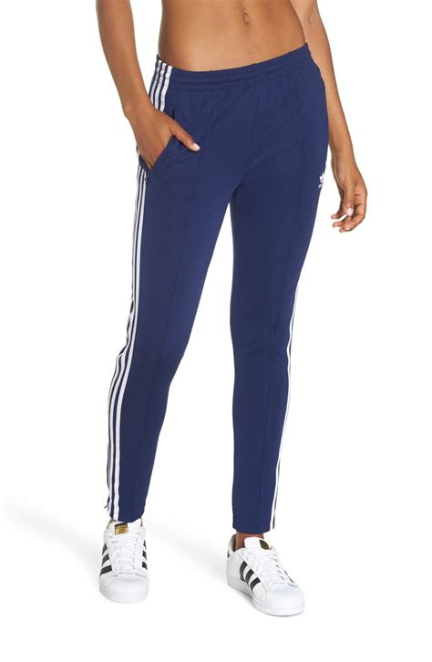 It seems that adidas invented the first track suit in 1964. adidas SST Track Pants | Nordstrom