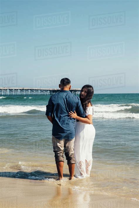 Couple Standing On Beach Rear View Seal Beach California Usa