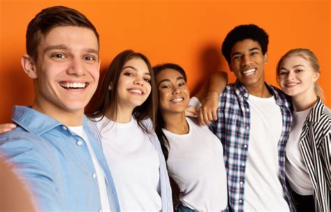 Teen Friends Making Selfie And Having Fun Orange Background Hoover