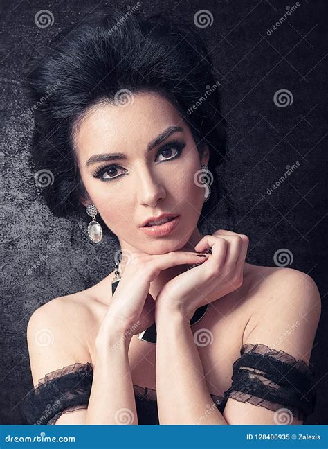 Sensual Brunette With Big Hair And Retro Make Up Closeup On Bla Stock