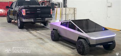 Tesla Cybertruck Mini Takes Out Full Sized Ford F 150 In Tug Of War Bout