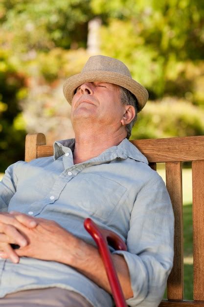 Premium Photo Senior Man Sleeping On The Bench