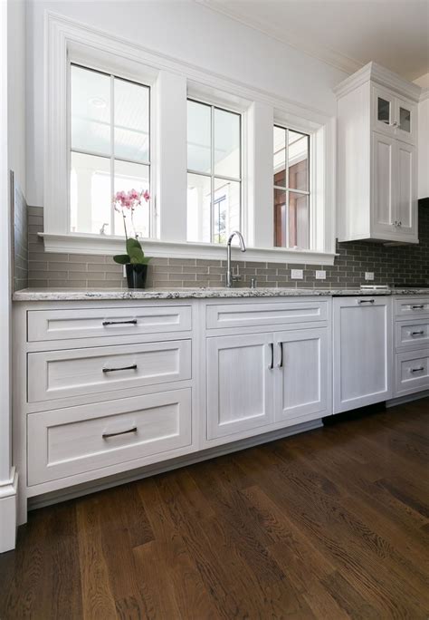 Here are terminology and definitions for kitchen they differ from wall cabinets which hang on the wall. deep drawers, paneled dishwasher, stacked cabinets, white ...