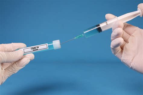 Maybe you would like to learn more about one of these? Doctor or nurse filling a syringe with Covid-19 Vaccine ...