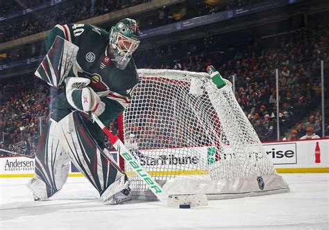 St Paul Mn November 15 Devan Dubnyk 40 Of The Minnesota Wild Plays The Puck During A Game