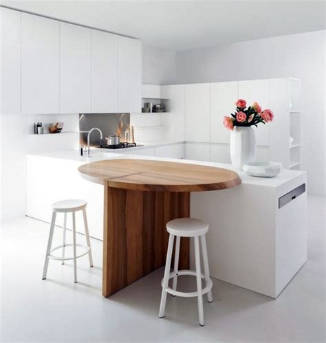Minimalistic White Kitchen With A Dining Area By Elmar Studio