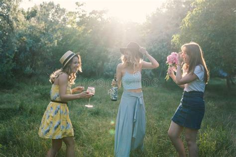 Group Of Girls Friends Making Picnic Outdoor They Have Fun Stock Photo