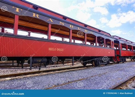 A Long Empty Antique Open Air Railroad Passenger Car Called The Hello