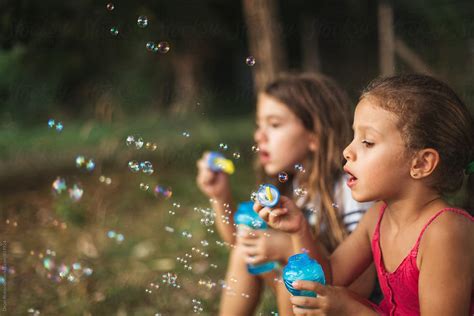 Children Blowing Bubbles By Dejan Ristovski