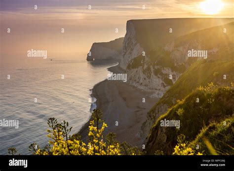 Golden Sunset Over The Jurassic Coast With View To The White Cliffs Of