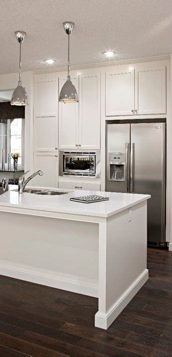 White kitchen cabinets are actually no harder to keep clean than any other. White Kitchen Cabinets with Stainless Steel Appliances - Modern - kitchen - Cardel Designs