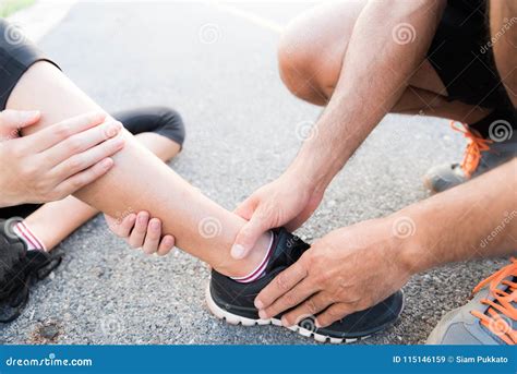Ankle Sprained Young Woman Suffering From An Ankle Injury Stock Image