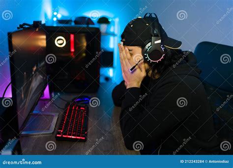 Disappointed Gamer Losing A Match In A Videogame Stock Photo Image Of