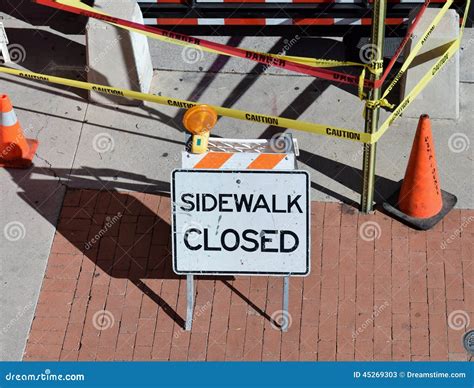 Sidewalk Closed Sign Due To Road Construction Stock Photo