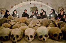 nuns romanian easter ossuary orthodox monastery skulls pasarea dead sisters mark skull sing celebrate remains human among romania bucharest sunday