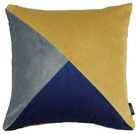 The huge, turquoise pillows and small, yellow one is a great way to add some color to the sofa. Diagonal Patchwork Velvet Navy, Yellow + Grey Cushion ...