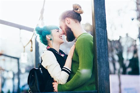 Happy Couple In Love Hugging And Kissing On The Street By Stocksy Contributor Jovana Rikalo
