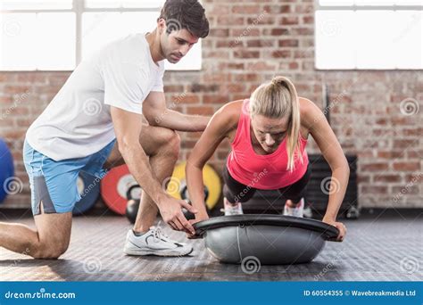 Trainer Motivating Client Doing Push Ups Stock Image Image Of Male