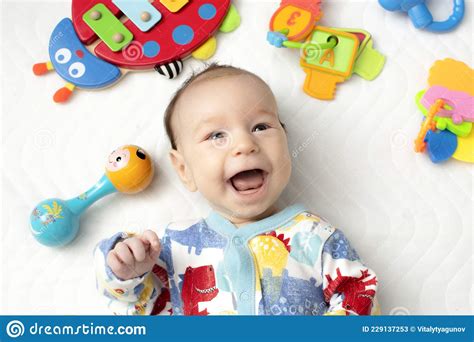 Joyful Baby Lying On His Back Among Toys Stock Image Image Of Playing