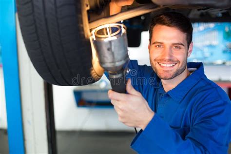 Mechanic Using Torch To Look Under Car Stock Photos Free And Royalty