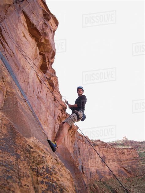 Man Rock Climbing Stock Photo Dissolve