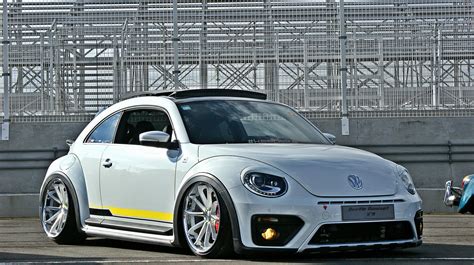 Customized To Impress White Volkswagen Beetle Dressed In Aftermarket