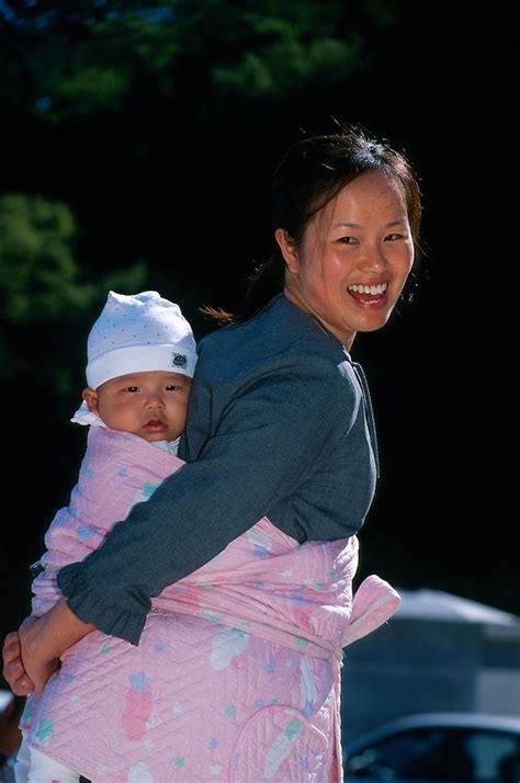 Mother Carrying Baby On Back In Traditional Korean Manner Pusan South