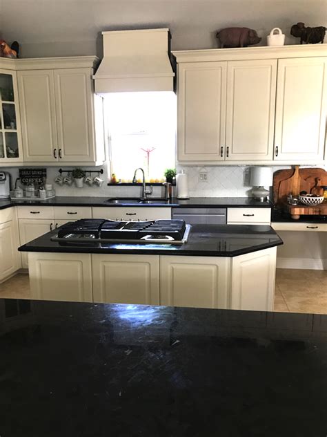 If you missed my painted tile tutorial the first time, you can read it here! How I painted my travertine backsplash in three easy steps.