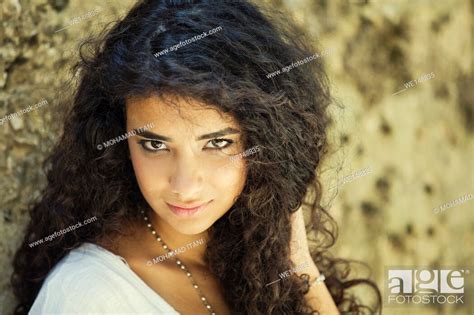 Beautiful Middle Eastern Girl With Curly Hair Outdoors Stock Photo