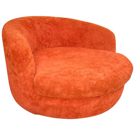 Crafted with a plywood frame, this piece is padded with foam and wrapped in faux leather upholstery in a solid hue, so it's easy to wipe clean for minimal maintenance. Wondeful Milo Baughman Oversized Round Swivel Lounge Chair ...