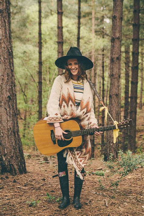 Beautiful Teenager With Guitar In The Woods By Stocksy Contributor