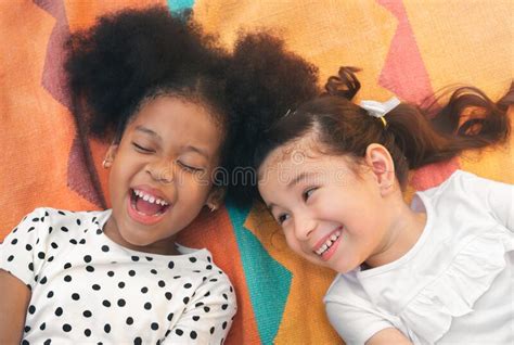 Happy Cheerful Ethnic Girls Laying On Mat At Outdoors Park Her Smiling